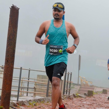 Sandeep Bazar running a hill race in the rain